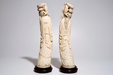 A pair of tall Chinese ivory figures of a fisherman and woman, 19/20th C.